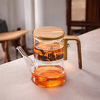 Herbal tea brewing in magnetic glass teapot