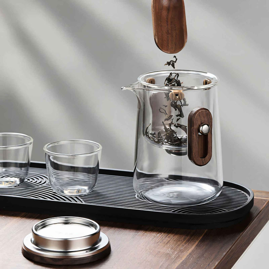 Outdoor tea brewing glass teapot and cups